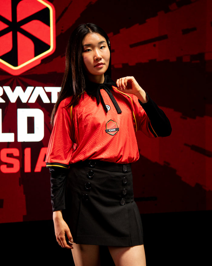 Woman in red china jersey facing front